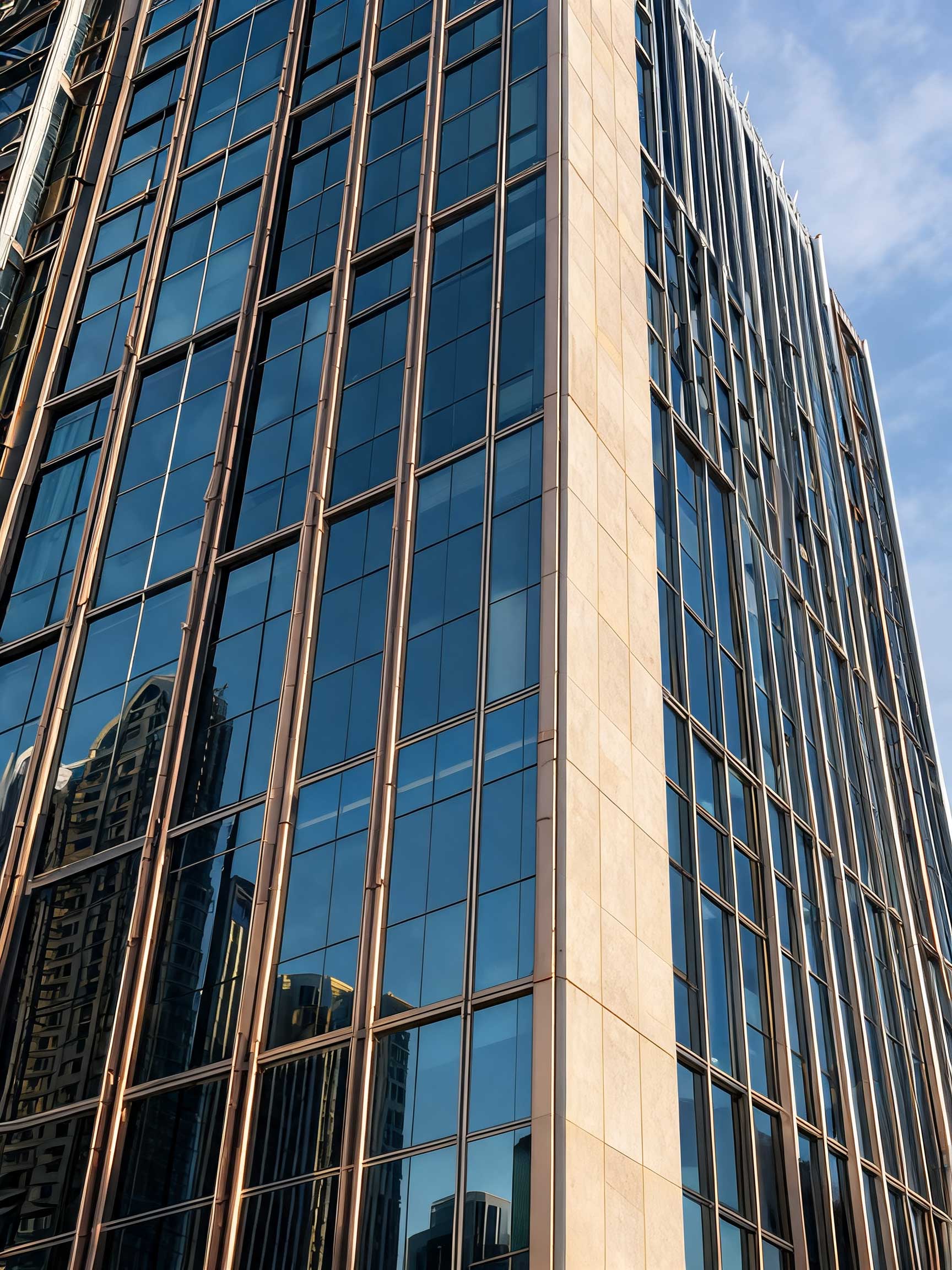 Glass office tower against a clear sky